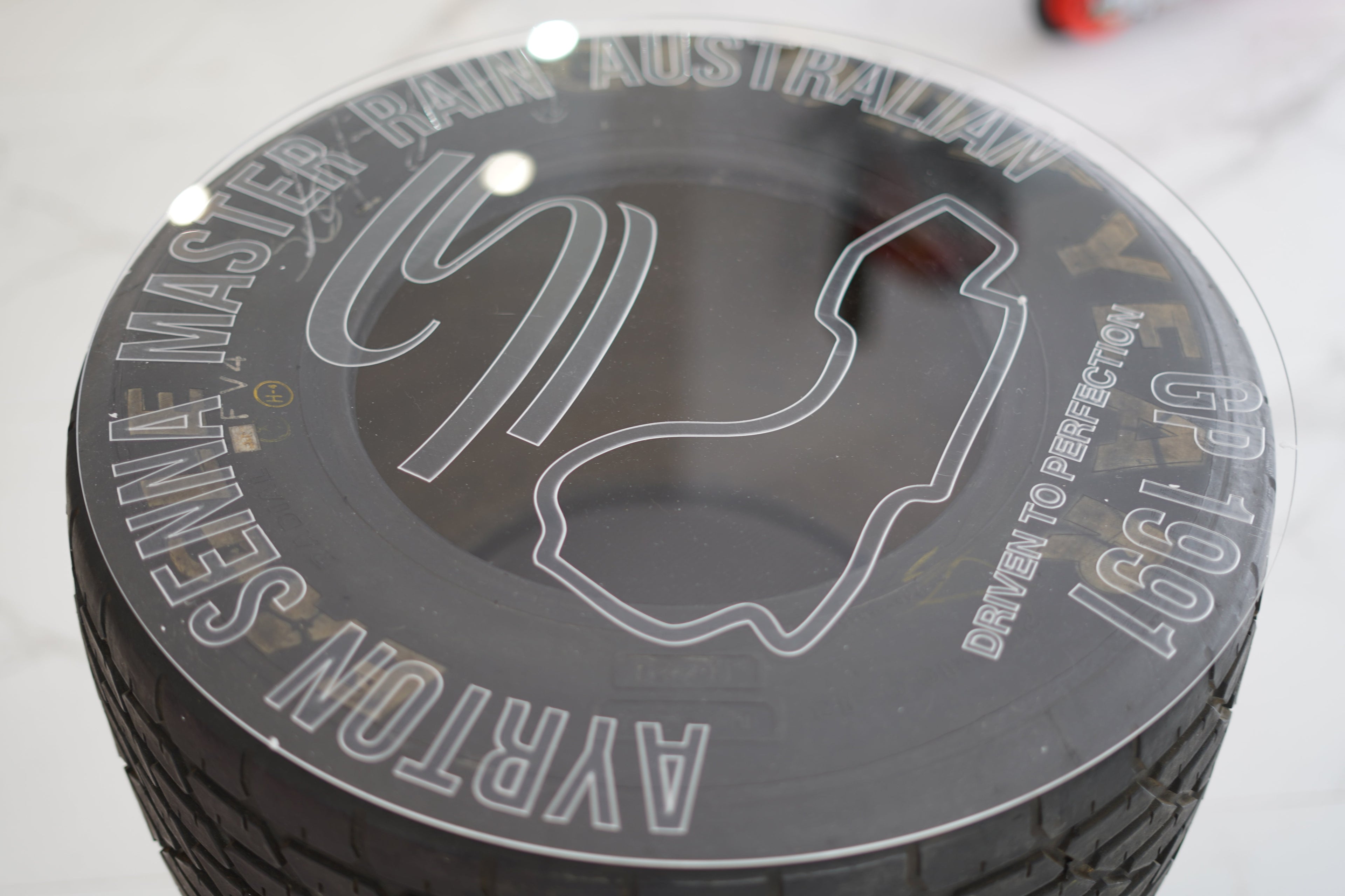 1991 Ayrton Senna MP4/6 front tire table signed