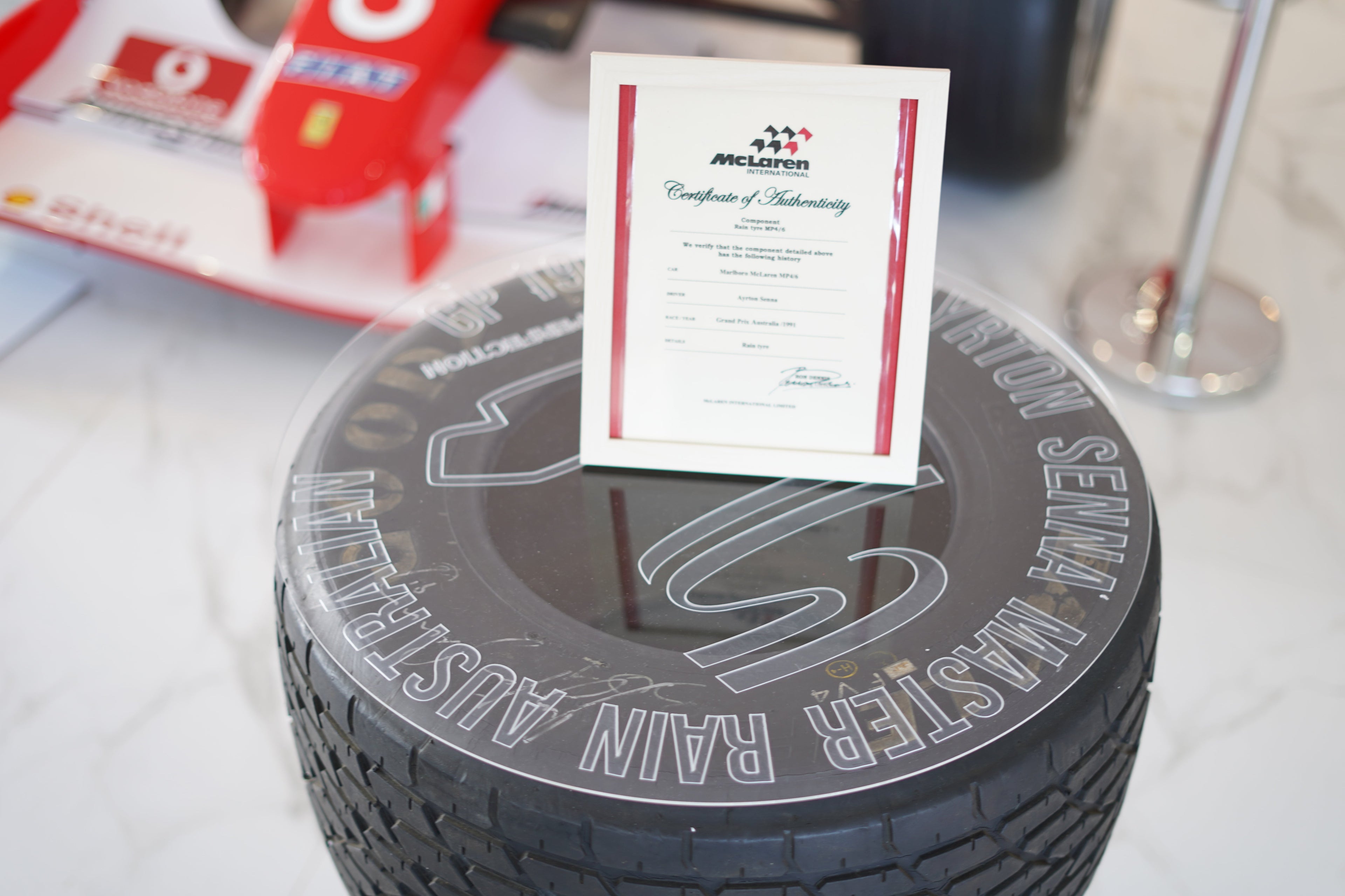 1991 Ayrton Senna MP4/6 front tire table signed